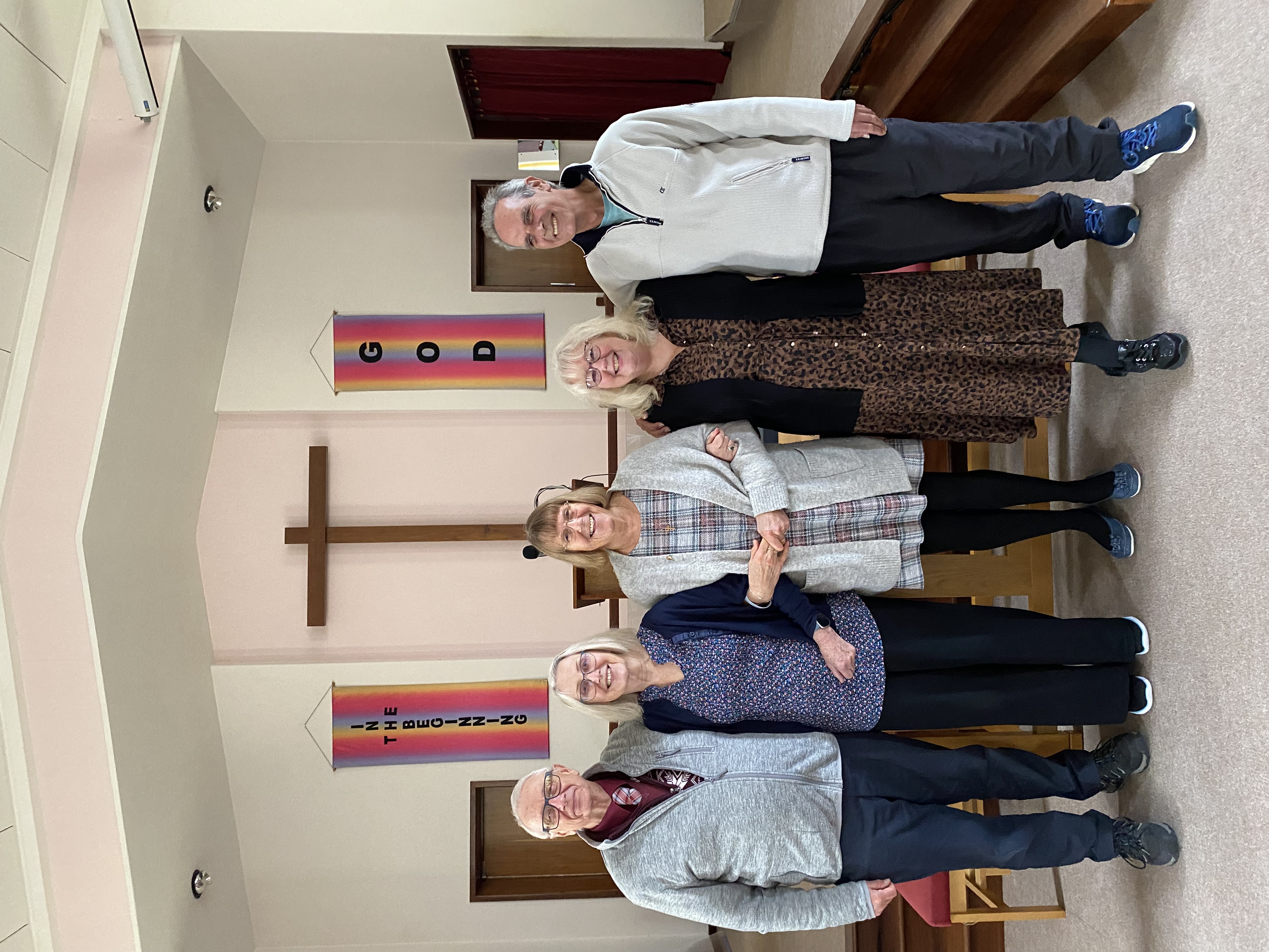 Church members sharing tea and coffee together in the church hall
